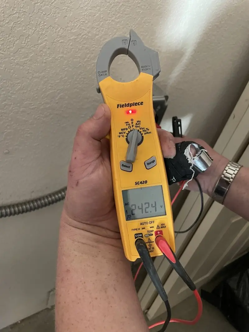 Voltage testing with clamp meter during Outlet Installation in Brillion